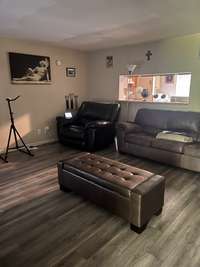 Another view of the Living Room and pass through window to Kitchen.