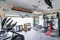 Two car garage currently being used as a home gym but can easily be converted back.