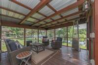 Screened in porch off the living room with views of the lake