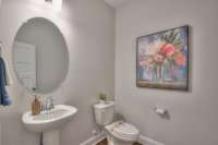 1st Floor Powder Bath Photo of Model Home, Color Selections & Finishes will Vary.