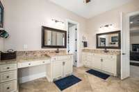 Primary bath with separate vanities.