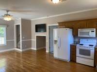 Living room kitchen. Upstairs has large storage area and 1 bedroom