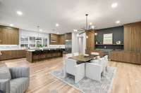 Another angle featuring the dry bar with a wine fridge and fantastic cabinet storage.