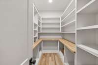 Great storage space in the pantry with copious built-ins and a butcher block counter.