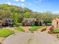 With traditional details throughout – cherry cabinetry, polished brash fixtures, chandeliers, and a fireplace – and thoughtful updates including a stained glass window and a massaging soaking tub, this home is the crowned jewel of the cul de sac.