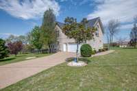 Lengthy driveway & extra garage entrance