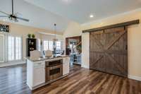 Newly installed barn doors with large pantry space right in the kitchen area for quick access