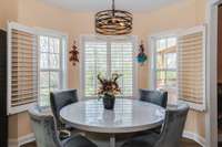 Round or oblong table can fit in this breakfast area overlooking fenced yard