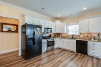 Expansive counter space with easy entrance to 2 car garage