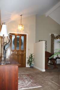 Vaulted entry and Living room