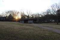 Peek a Bye Sunset, West side of Property