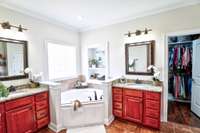 Double vanities & a soaking tub in the primary bath.