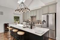 Stainless steel appliances and quartz counters.