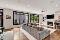 Tons of natural light with large windows in the living area. Gas fireplace with quartz mantle.