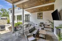 Covered entertaining space in courtyard with gas fireplace.