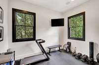 Home gym with composite rolled rubber flooring.