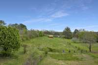 That view!! 2 stall horse barn in the back with fencing ready to go!