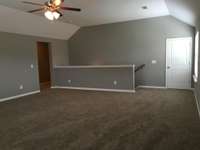 File photo Bonus room with open wood spindles