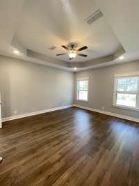 Stock photo of owner's suite. Laminate upgrade instead of carpet is available with early contract.