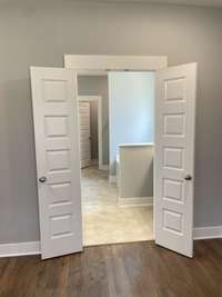 Stock photo of entrance to owner's suite bathroom