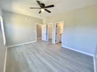 Master bedroom with attached walk-in closet and full bath