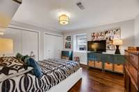 Bedroom 2 with access to 2nd laundry and storage area through closet doors on the right