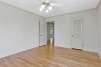 Walk-in closet that leads to attic storage.