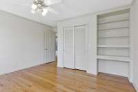 Closet and a built-in desk with shelving.