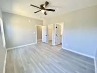 Master bedroom with attached walk-in closet and full bath