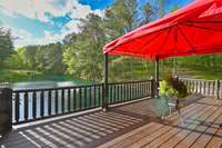 Step onto the deck from the top floor to bask in the serene pond views, soak up the sun, or unwind under the shade of the tent, offering the perfect spot for relaxation and enjoyment of the tranquil surroundings.