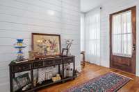 Modern farmhouse with shiplap and high ceilings.