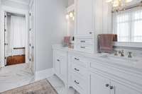 Double vanity and so much cabinetry.