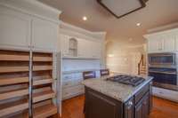 The previous pantry has been replaced by pull-out boxes making storage more easily accessible.