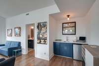 Third floor recreation room with wet bar and access to the covered porch.