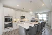 Gourmet Kitchen with double ovens (model home image)