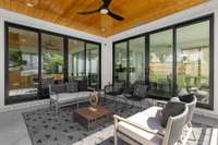 Take the party right outside onto the huge covered back porch, which has beautiful modern railings, and ceiling fan.