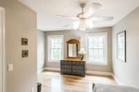 Third bedroom upstairs with walk in closet and hardwood floors