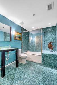 Guest bath serves second bedroom, and functions as a powder room as well.