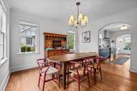 The seamless flow between the living room, dining area, and kitchen creates an open and interconnected space, perfect for effortless entertaining and everyday living.