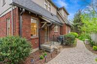 A side door entry grants direct access to the kitchen, enhancing convenience and facilitating seamless transitions between indoor and outdoor areas with a touch of sophistication.