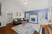 Open living room with cathedral ceilings and a gas fireplace!