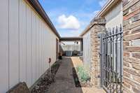 Fence area leading to the garage