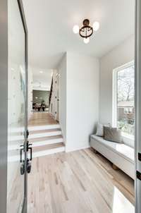 Walk in and you are greeted by this foyer with views of the accent wall in the dining room.