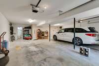 Two car garage with a exterior door leading to the outside