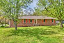 This all brick home is nestled in the Kon Tiki Subdivision on a corner lot.