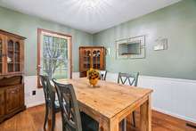 The dining area is capable of accommodating a dining table and cabinetry for dishes and serve ware.