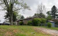 Side view of the home.  Notice the fenced in backyard.