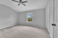 Light pours in to 2nd Bedroom, which  overlooks back open space.