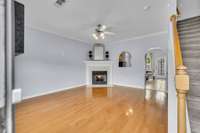 Living room with gas fireplace. Hard surface flooring throughout the first floor.