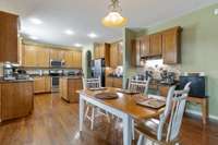 Large kitchen eat in area! Wonderful kitchen perfect for entertaining family & friends or a quite dinner at home. Granite countertops with SS appliances. Amazing coffee bar area!